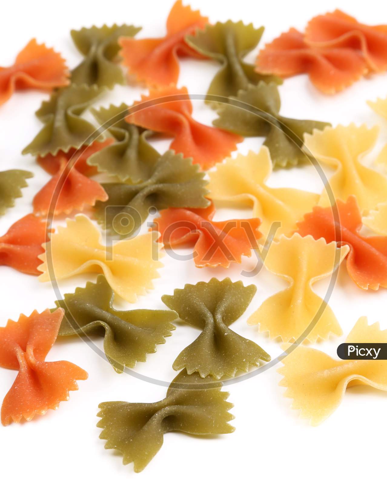 Farfalle Pasta Three Colors. Close Up. Whole Background.