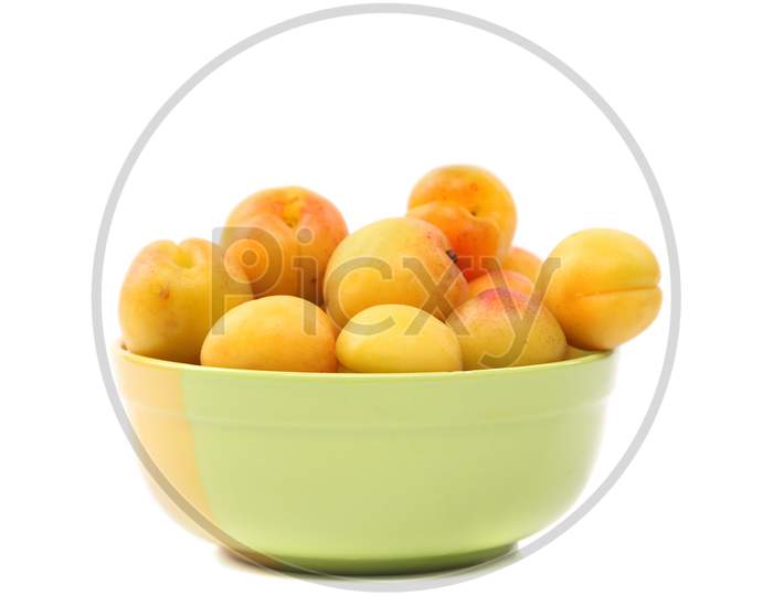 Apricots In A Deep Plate. Isolated On A White Background.