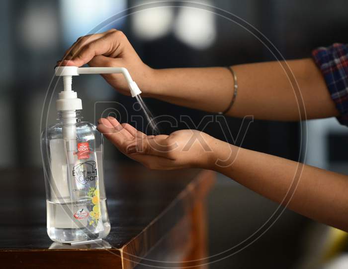 Using Hand Sanitizer to wash Hands to kill the pathogen virus entry into human body