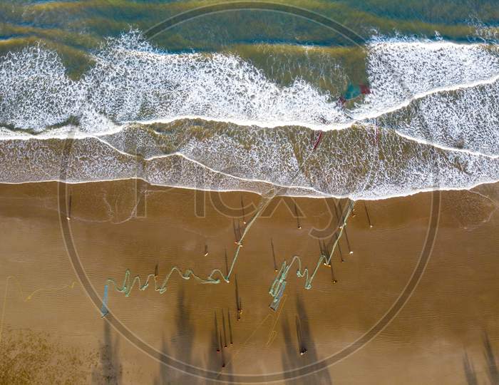 Aerial view of Fishing Net in the beach by fisherman in kudle beach