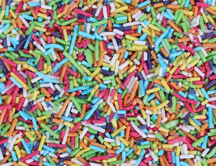 Colored Sugar Sprinkles Decoration. Close Up. Whole Background.