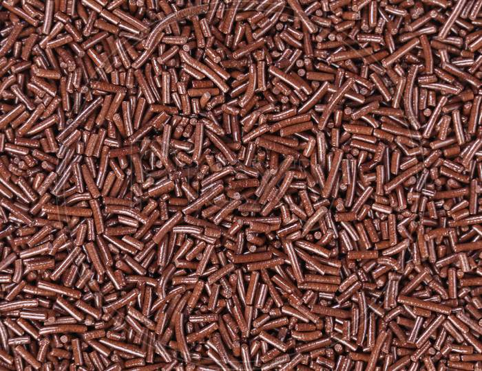 Close Up Of Chocolate Sprinkles. Whole Background.