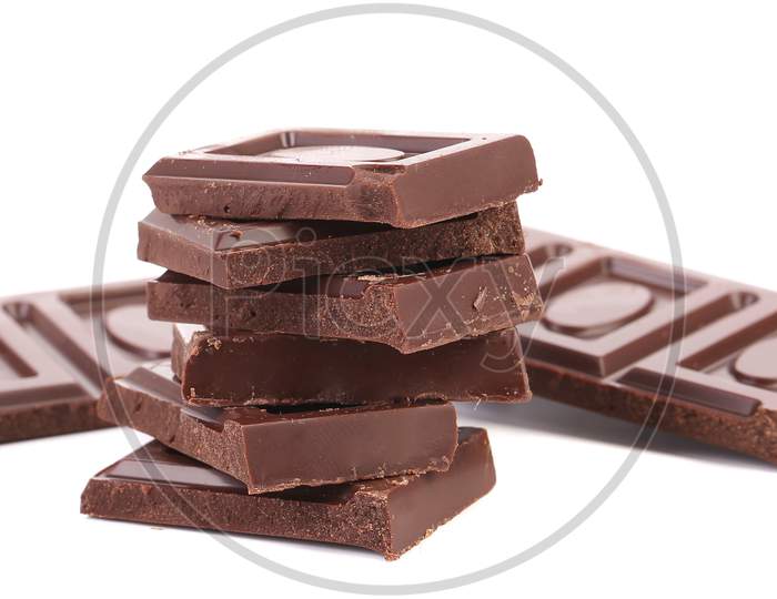 Stack Of Chocolate Bars Broken. Isolated On A White Background.