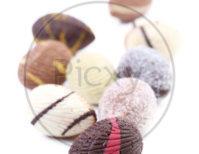 Bunch Of Colorful Chocolate Seashell. Isolated On A White Background.