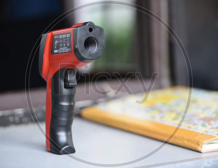 An Infrared Thermometer used to find out the human body temperature as fever is one of the symptoms of COVID19 Corona Virus