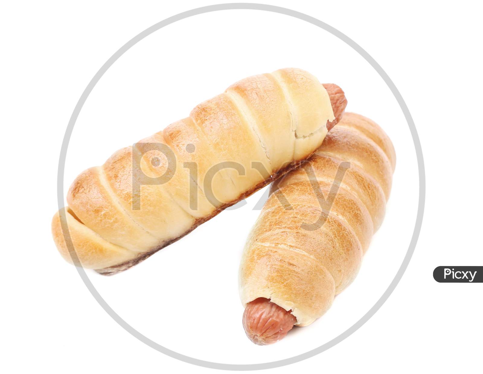 Close Up Of Baked Hot Dogs. Isolated On White Background.