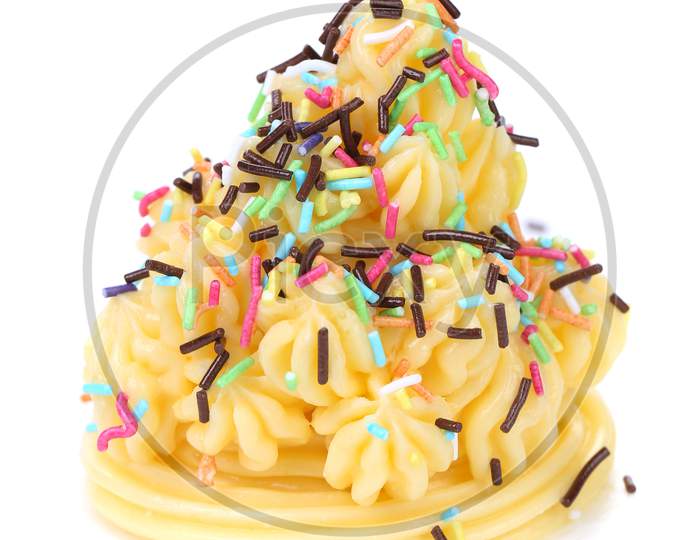 Cake Topped With Sprinkles. Isolated On A White Background.