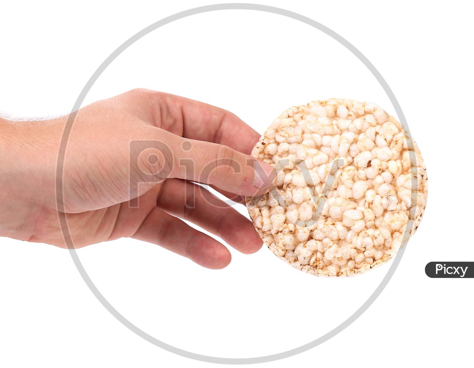 Puffed Rice Snack In Hand. Isolated On A White Background.