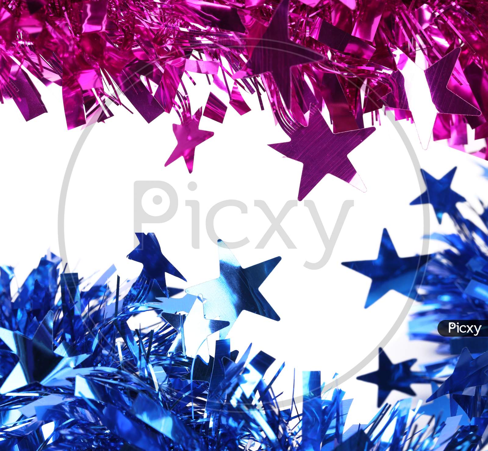 Blue And Purple Christmas Tinsel. Isolated On A White Background.