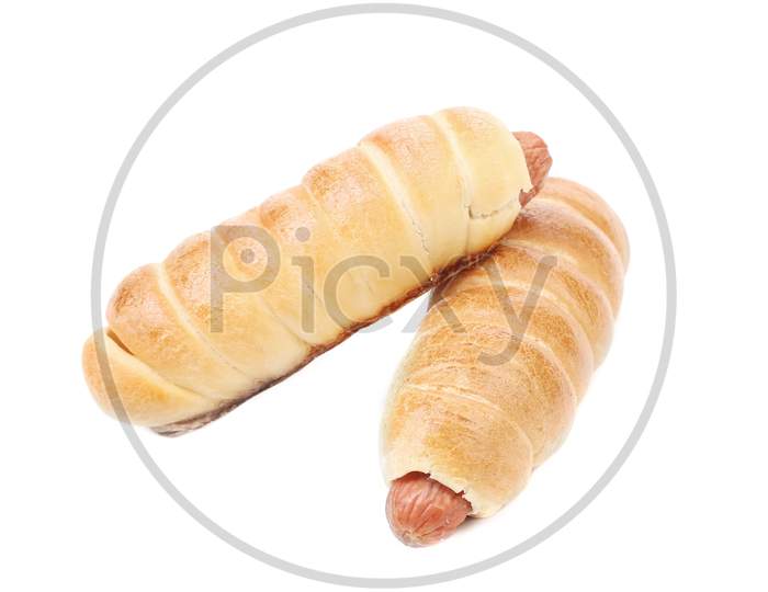 Close Up Of Baked Hot Dogs. Isolated On White Background.