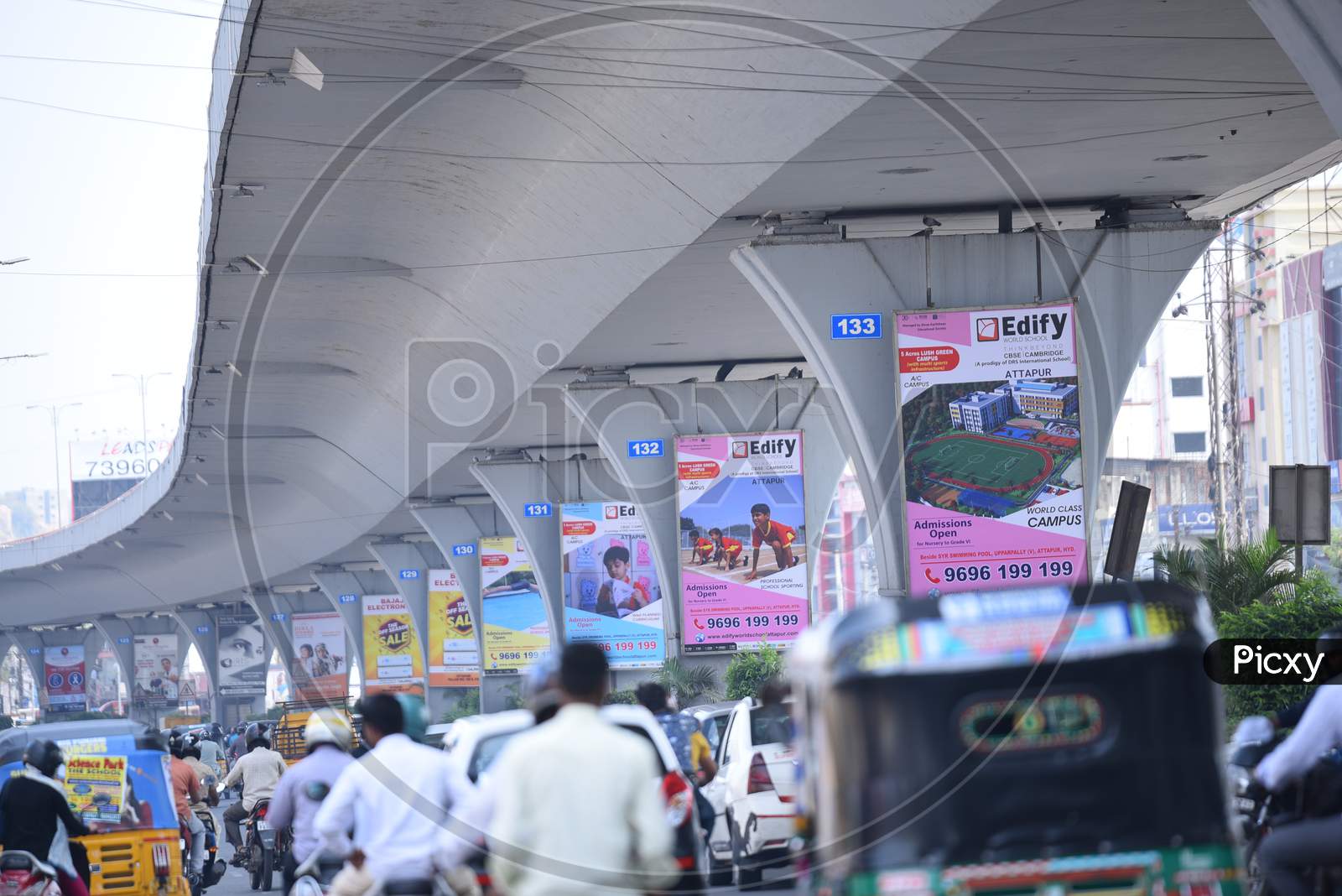 Usual traffic under PV Narasimha Rao Expressway in Rajendra nagar, Advertising on Flyover Pillars