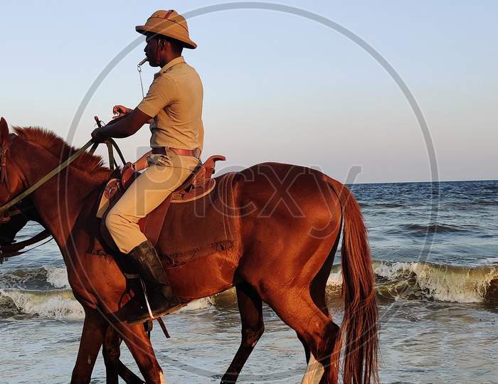 Indian Policeman on a horse in Marina
