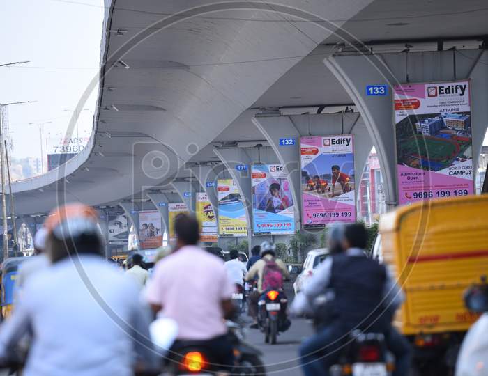 Usual traffic under PV Narasimha Rao Expressway in Rajendra nagar, Advertising on Flyover Pillars