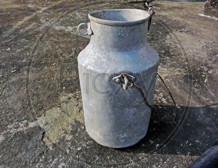 Rent To Bring Old Milk Can Throw On The Roof Of The House.