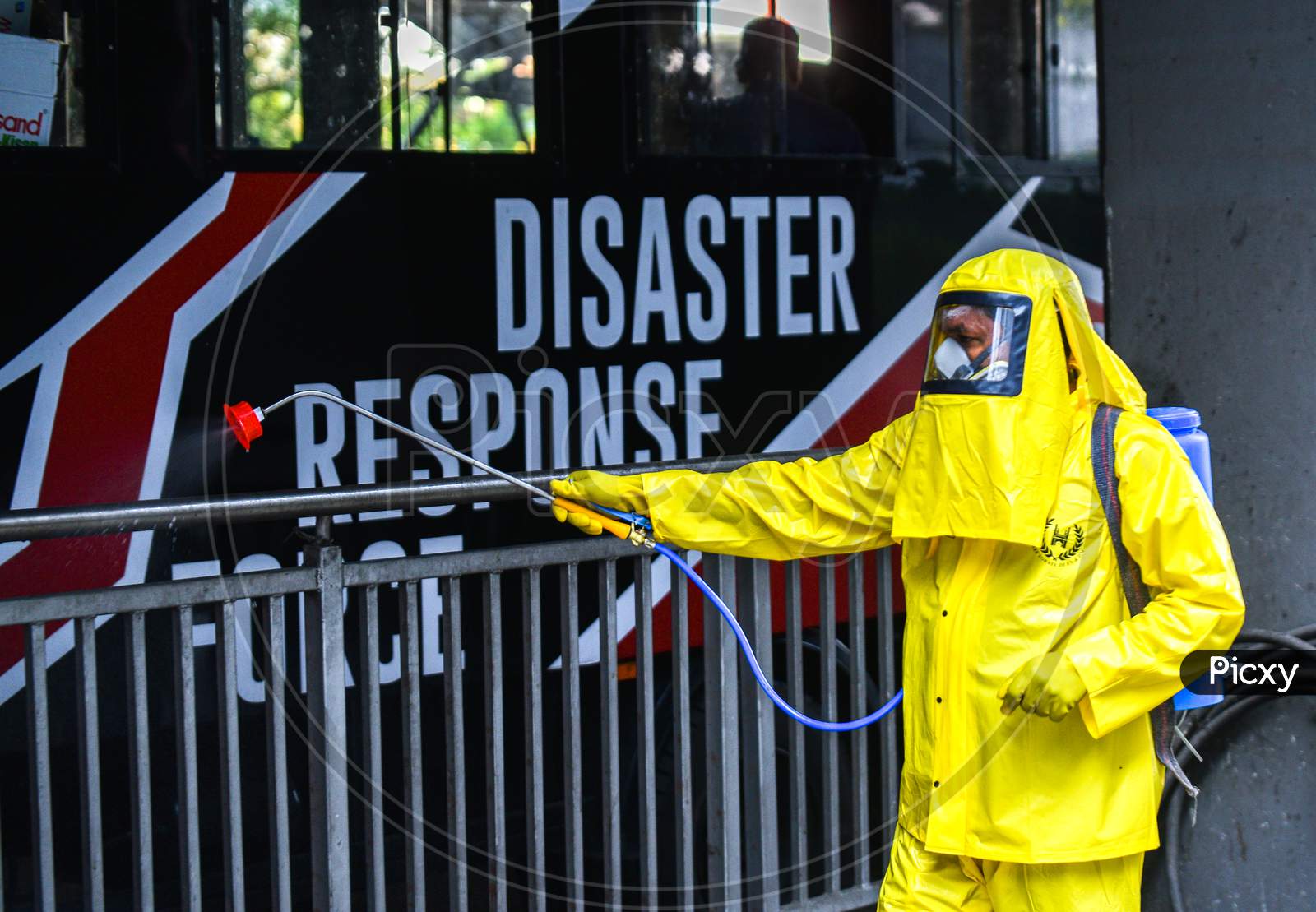 Disaster Response Force(DRF) team with full body suits spraying Disinfectant Solution across the Hyderabad City to reduce the spread of the COVID-19 Virus or Coronavirus