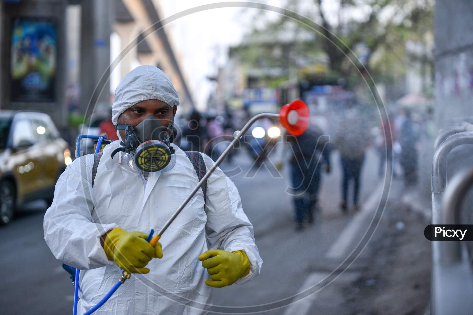 Disaster Response Force(DRF) team with full body suits spraying Disinfectant Solution across the Hyderabad City to reduce the spread of the COVID-19 Virus or Coronavirus at Ameerpet Metro Station