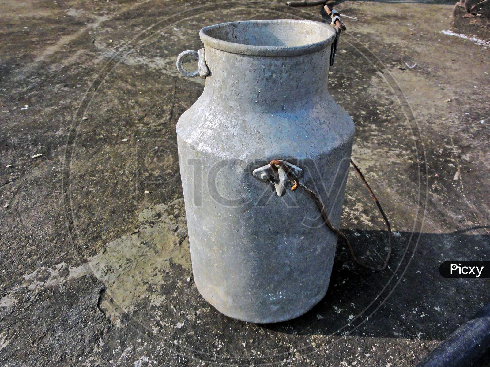 Rent To Bring Old Milk Can Throw On The Roof Of The House.