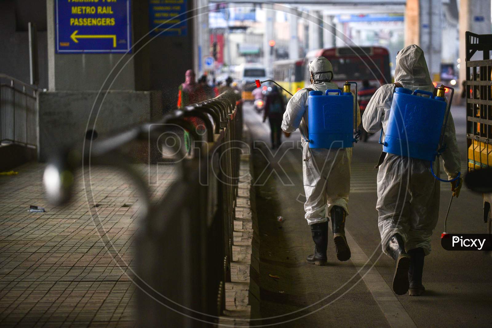 Disaster Response Force(DRF) team with full body suits spraying Disinfectant Solution across the Hyderabad City to reduce the spread of the COVID-19 Virus or Coronavirus at Ameerpet Metro Station