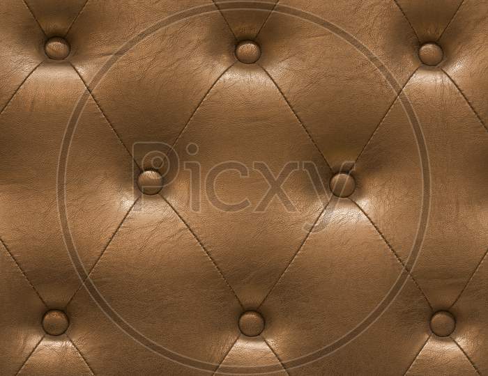 Highly Detailed Texture Of Golden Vintage Padded Leather Cloth.