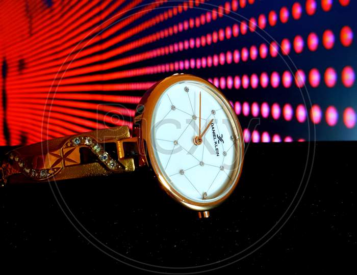 Woman Wrist Watch With Neon Lights in Background