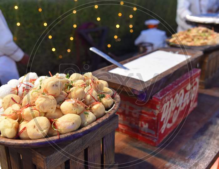 Food Stalls With Indian Food Items At an Indian Wedding Feast