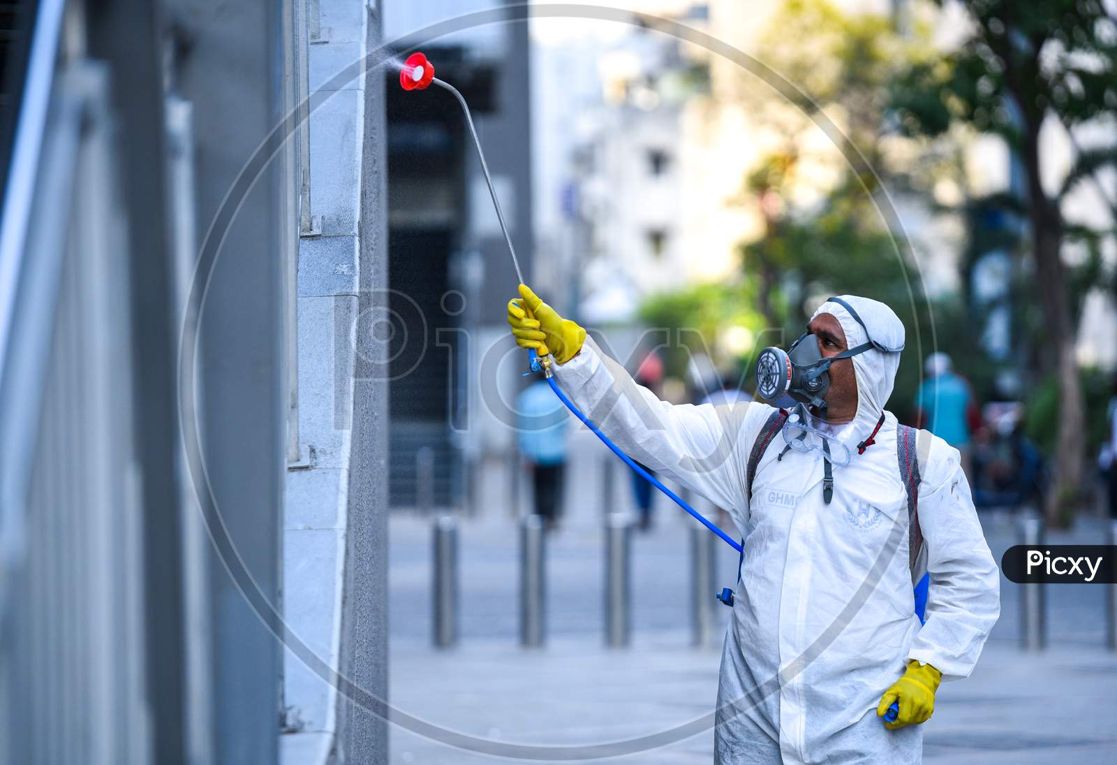Disaster Response Force(DRF) team spraying Disinfectant Solution across the Hyderabad City to reduce the spread of the COVID-19 Virus or Coronavirus with full body masks on