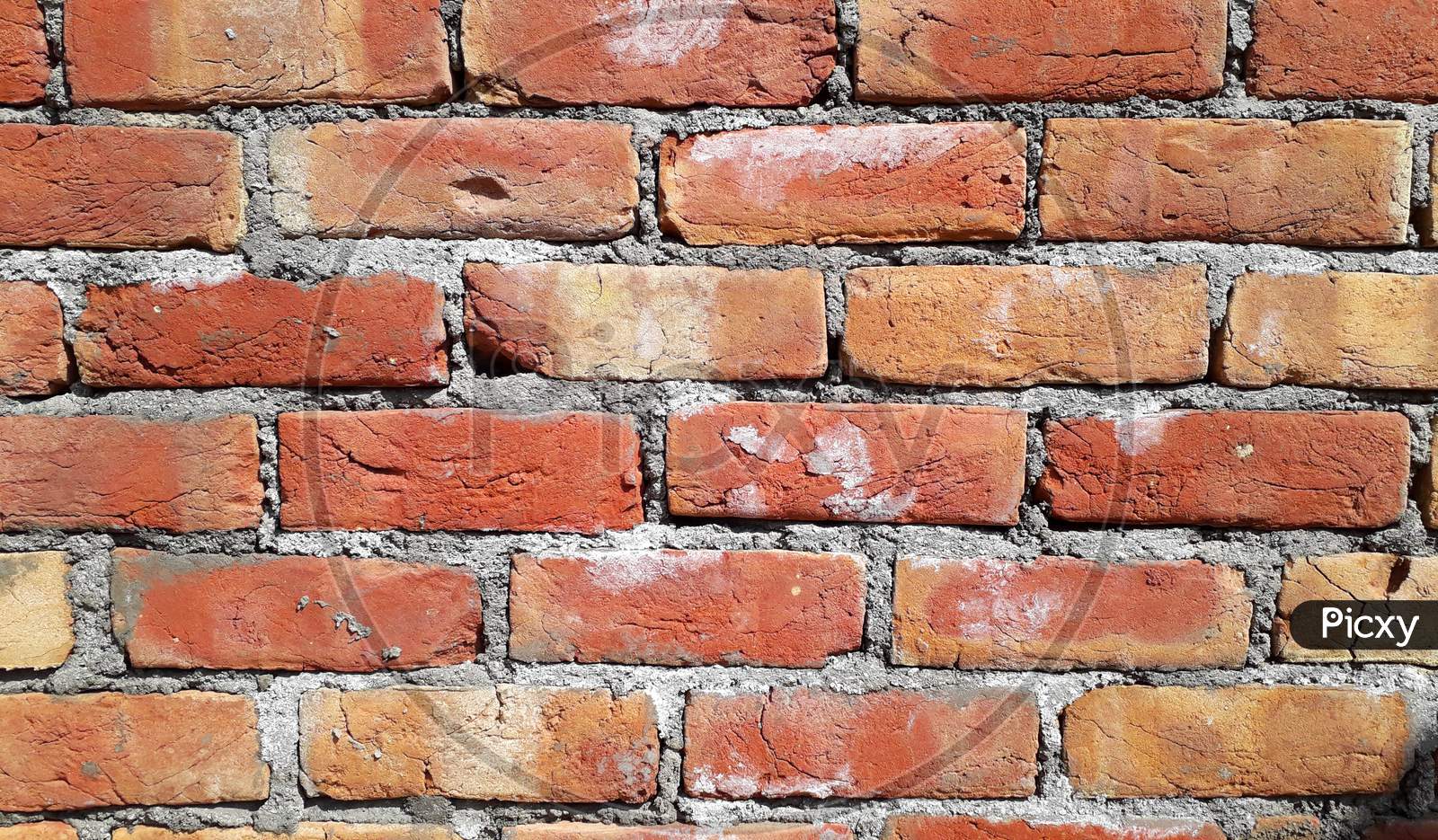 Red brick wall on a construction site/ realistic textures