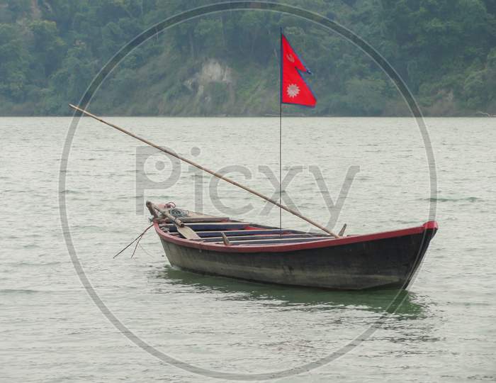 A Boat On River With Nepal Flag
