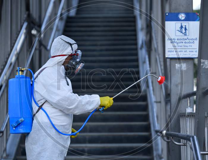Disaster Response Force(DRF) team spraying Disinfectant Solution across the Hyderabad City to reduce the spread of the COVID-19 Virus or Coronavirus with full body masks on