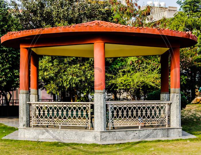 A Shelter With Benches In an Park