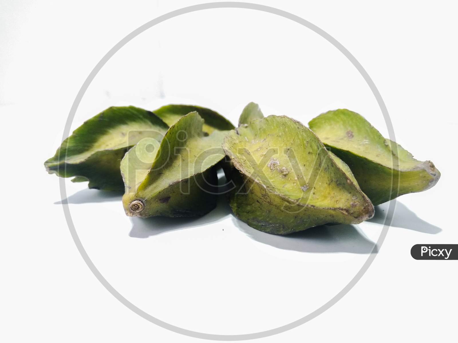 Green Star Fruit Or Carambola Fruit Over an Isolated White Background