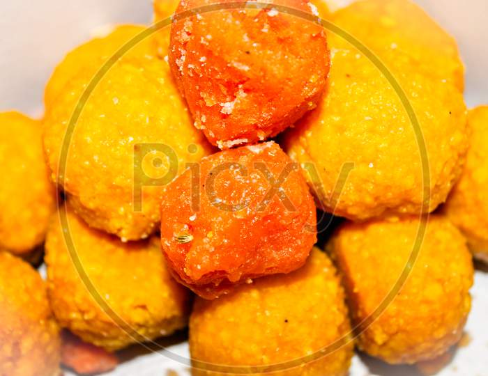 Indian Sweet  Besan Laddu Closeup Over an isolated White Background
