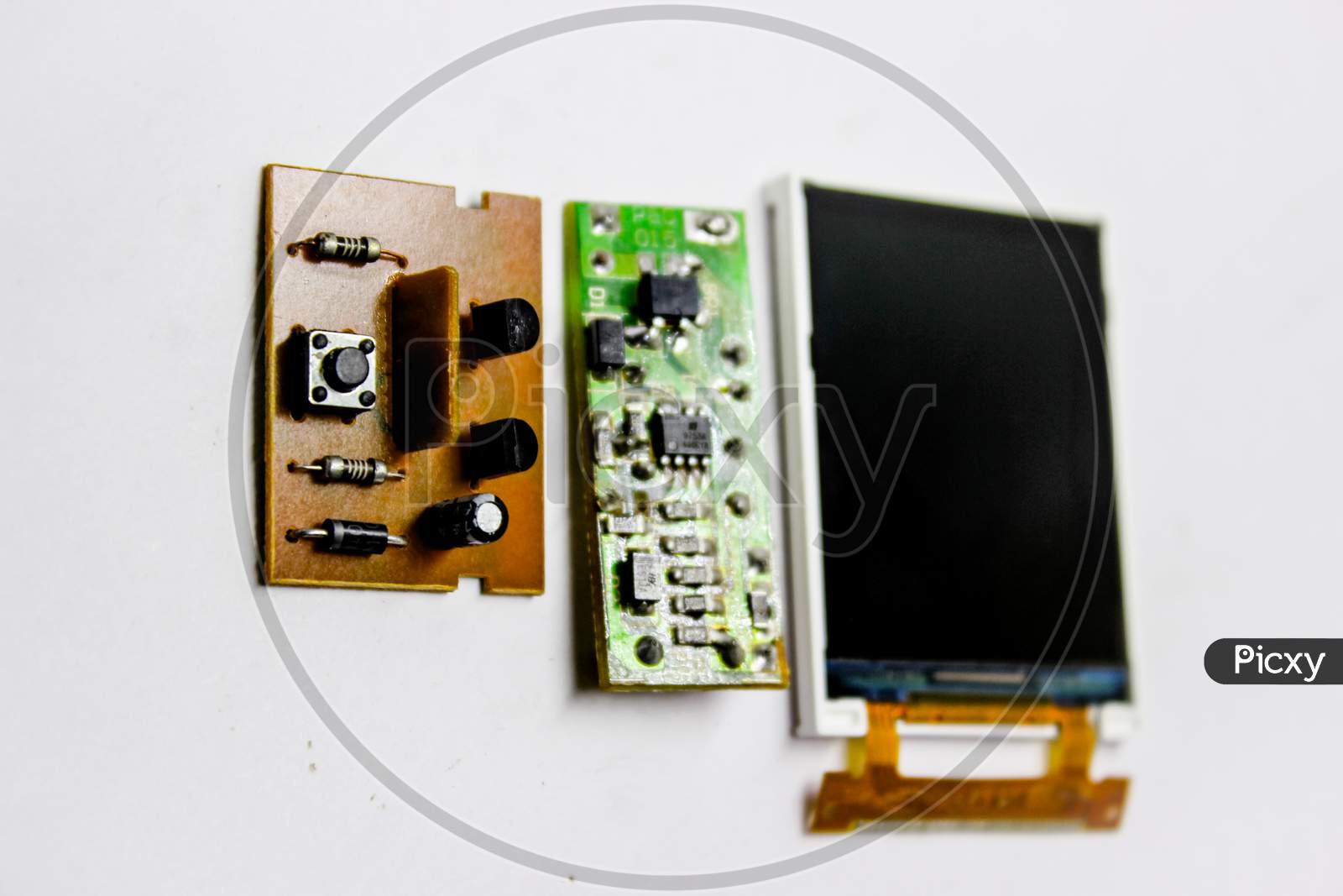 Electronic Device Interior Parts Mother Board And Display Panel Over an Isolated White Background