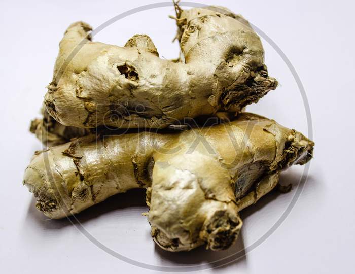 Ginger Roots Over An Isolated White Background
