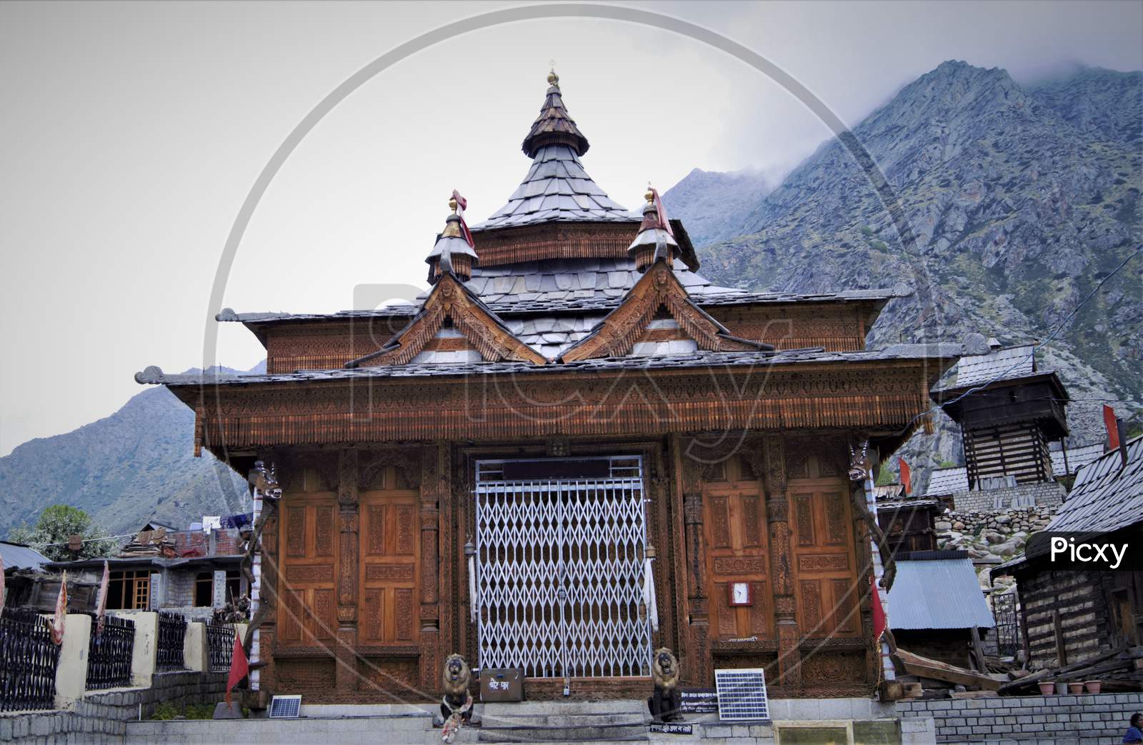 A close up view of beautiful temple in Himachal Pradesh constructed by wooden.