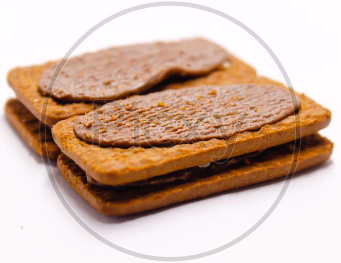 Bourbon Biscuit With Chocolate Cream Over An Isolated White Background