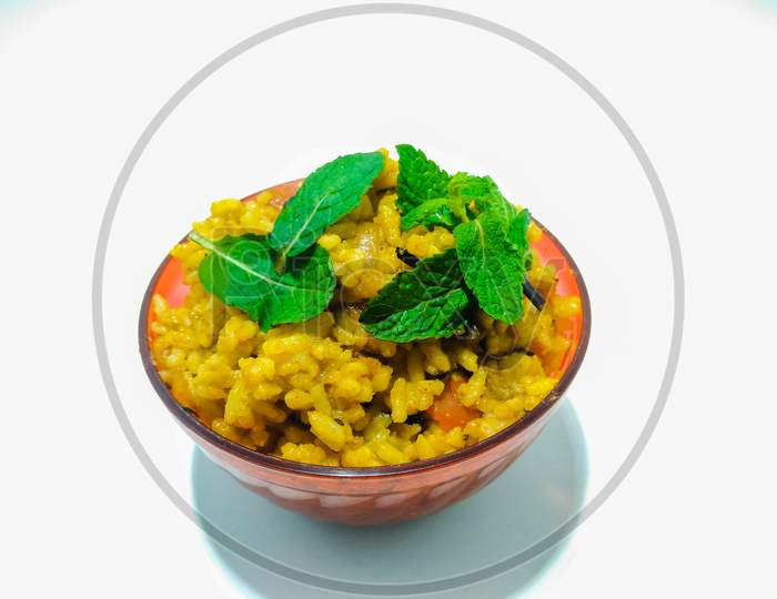 Indian Rice Dish Kichadi Or Dal Rice In a Bowl Over an isolated White Background