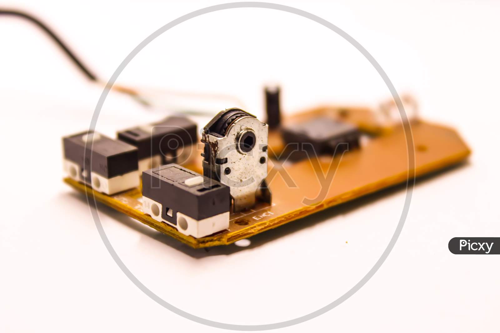 Mother Board of an Optical Mouse  Device With Amplifier And Micro Condensers Over An Isolated White Background