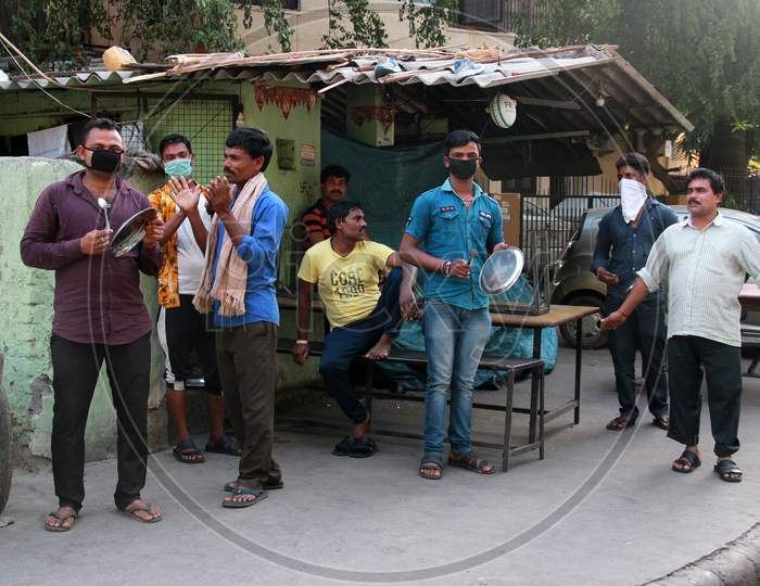 People Clapping And Making Sounds  in Delhi As Indian Prime Minister Narendra Modi Called For A 14 Hour Janta Curfew Or Self-Imposed Quarantine To Break The Highly Contagious Covid 19 Or Corona Virus Spread