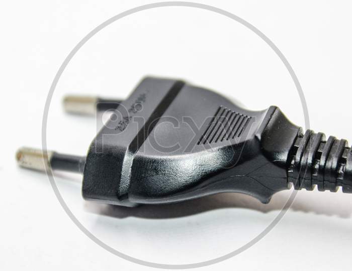 two pin Plug Of an Electronic Device Over an Isolated White Background