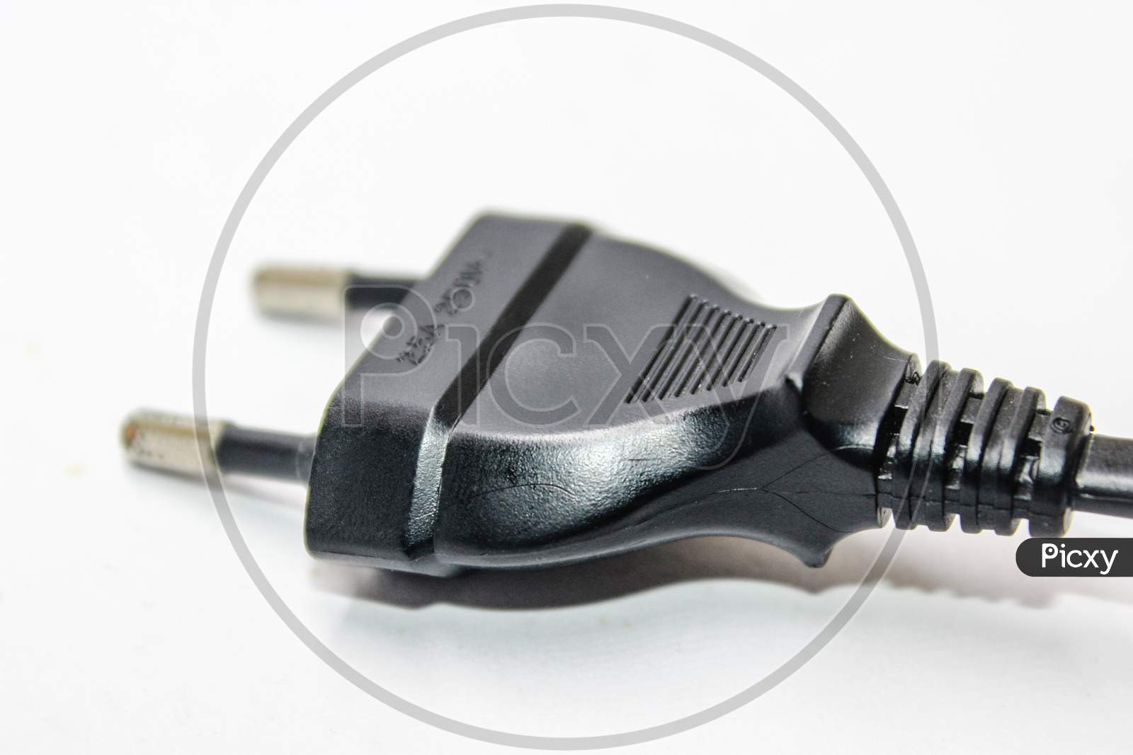 two pin Plug Of an Electronic Device Over an Isolated White Background