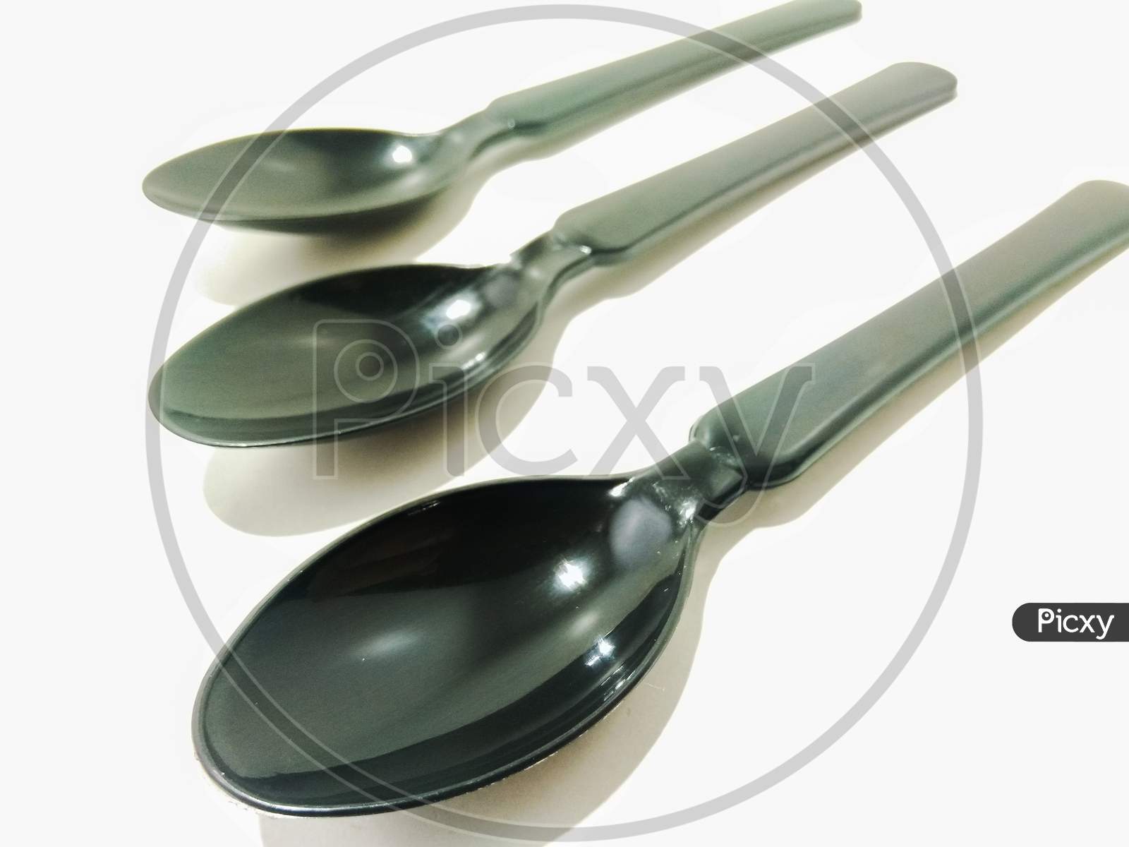 Black Spoon Over an isolated White Background