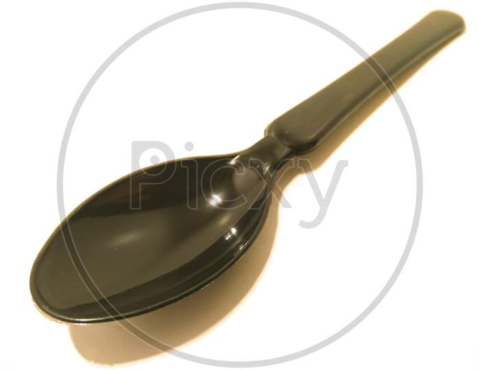 Black Spoon Over an isolated White Background