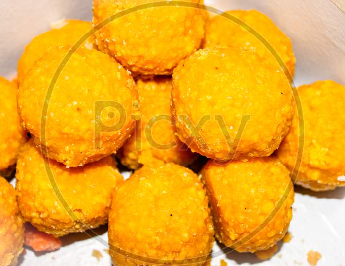 Indian Sweet  Besan Laddu Closeup Over an isolated White Background