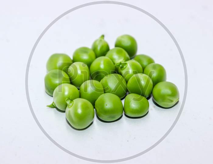 Green Peas Over an isolated White Background