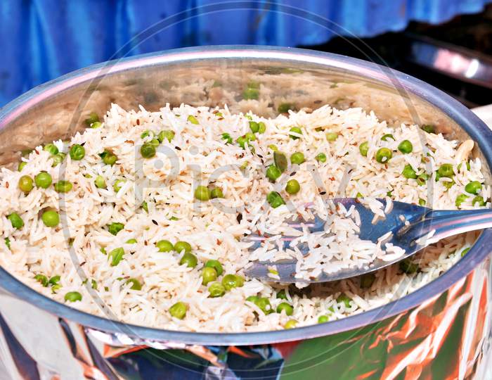 Garnished Rice With Peas On The Dish At The Wedding Party In Buffet