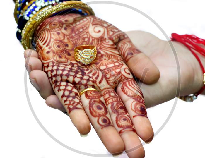 An Indian Bride And Groom Holding Their Hands With Ring During A Hindu Wedding Ritual
