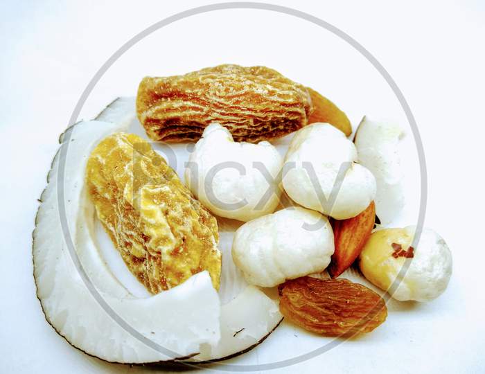 Dry Fruits Dates And Coconut On White Background