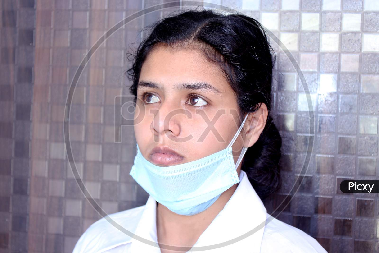 Female Doctor or Nurse Wearing Protective Mask on face for corona virus protection