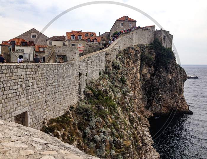 Dubrovnik walls and steep cliff.